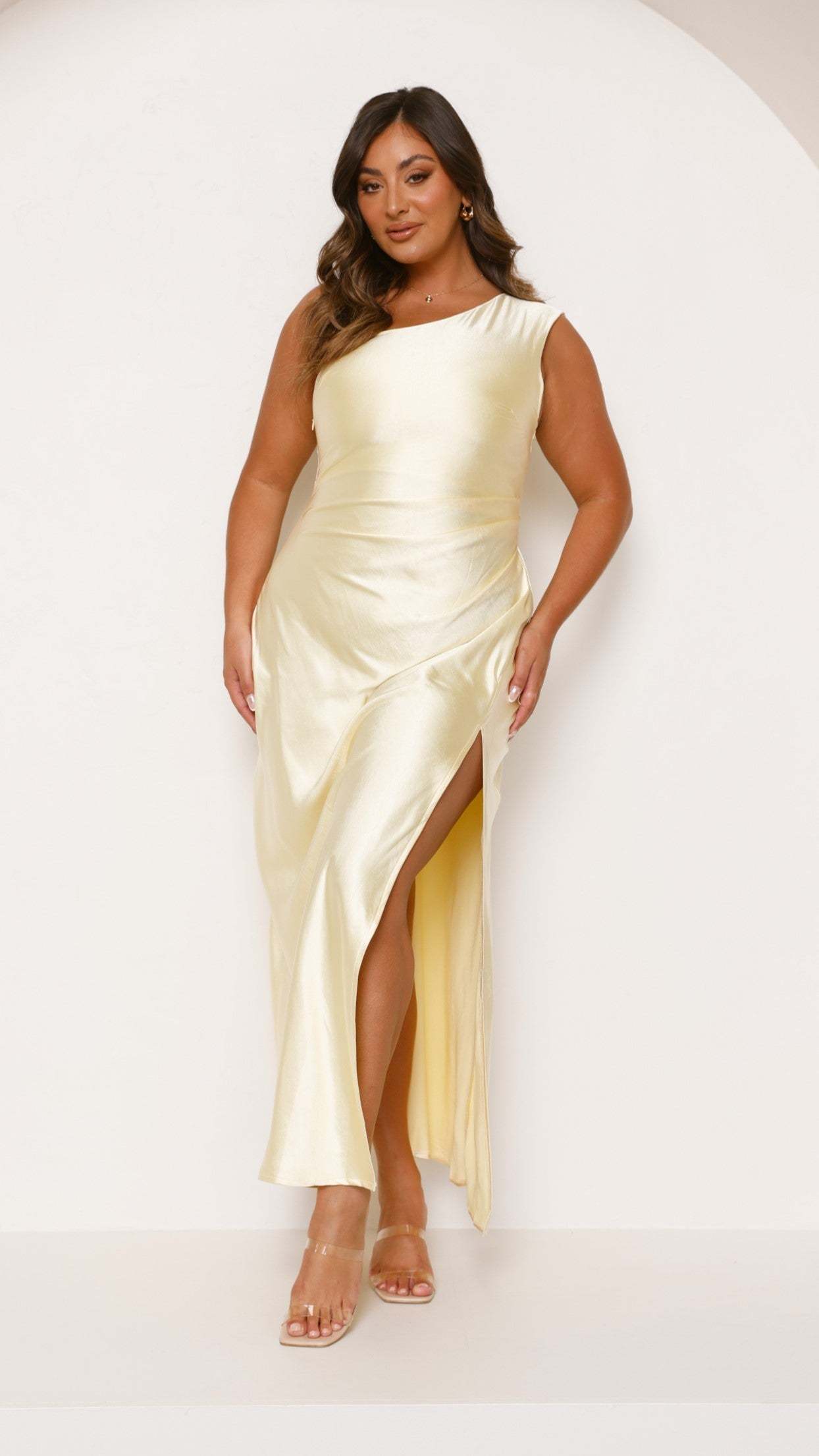 Sleeveless cream satin maxi dress with ruched waist and thigh slit