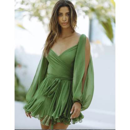 Green wrap mini dress with long billowing sleeves and ruffled hem
