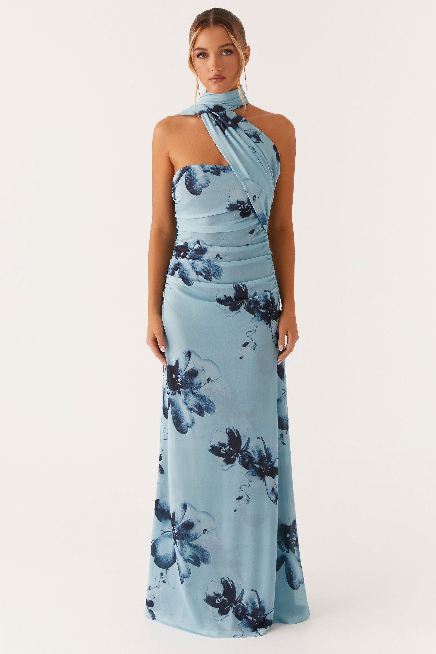 Light blue halter maxi dress with navy floral print and horizontal ruching throughout