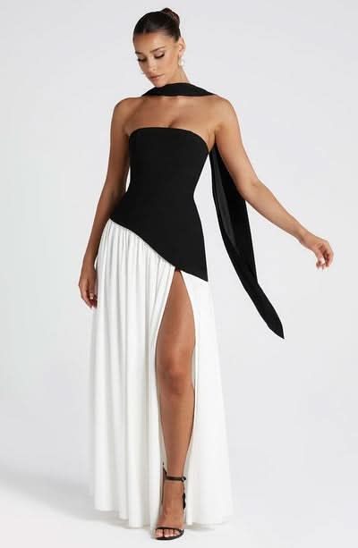 Front view of black and white wrap maxi dress with flowing pleated skirt