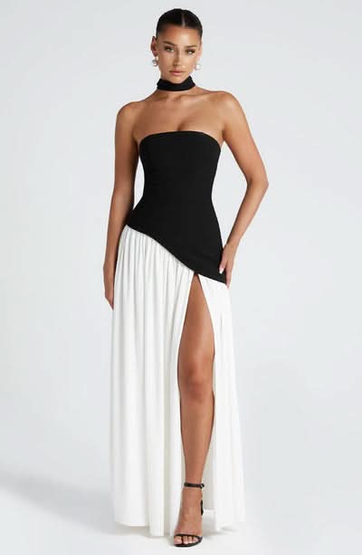 Black and white wrap maxi dress with strapless bodice and high leg slit