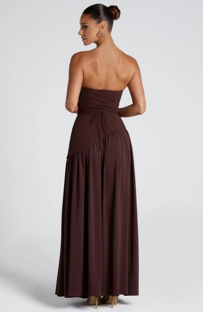 Brown strapless maxi wrap dress back view with flowing asymmetrical hemline