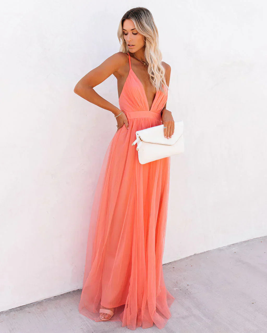Coral halter backless maxi dress with gathered waist and flowing train