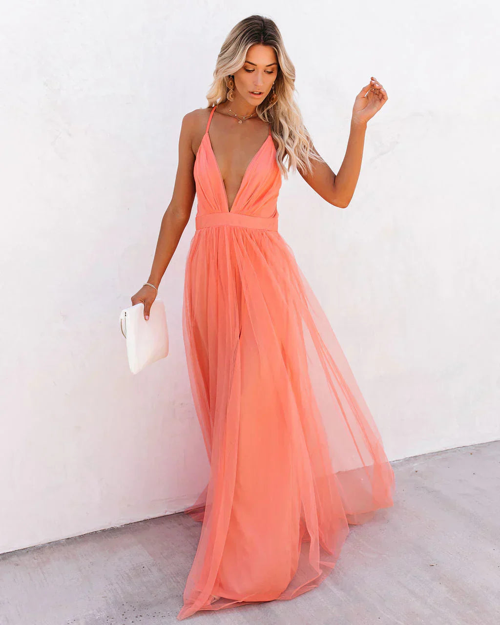 Front view coral tulle maxi dress with plunging neckline and open back