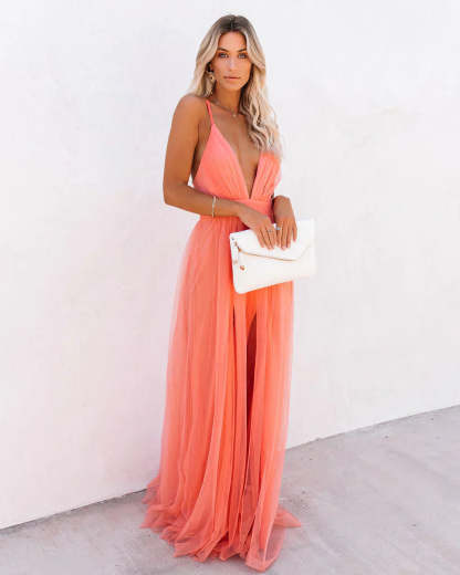 Three-quarter view of coral backless maxi dress with V-neckline and tulle layers