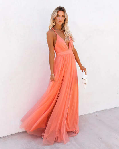 Coral tulle backless maxi dress with deep V-neckline and flowing skirt