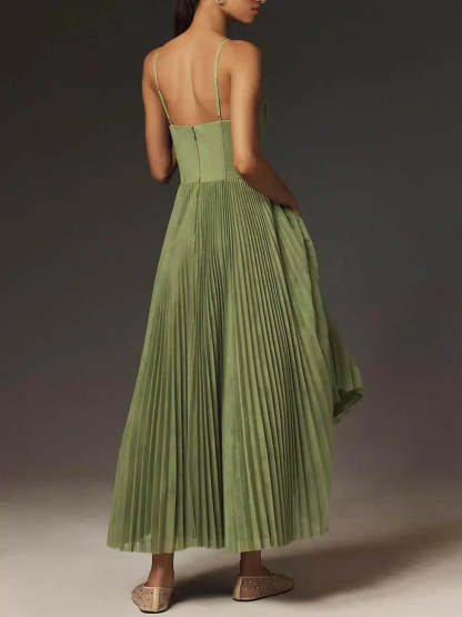Back view of sage pleated maxi dress showing open back and full skirt