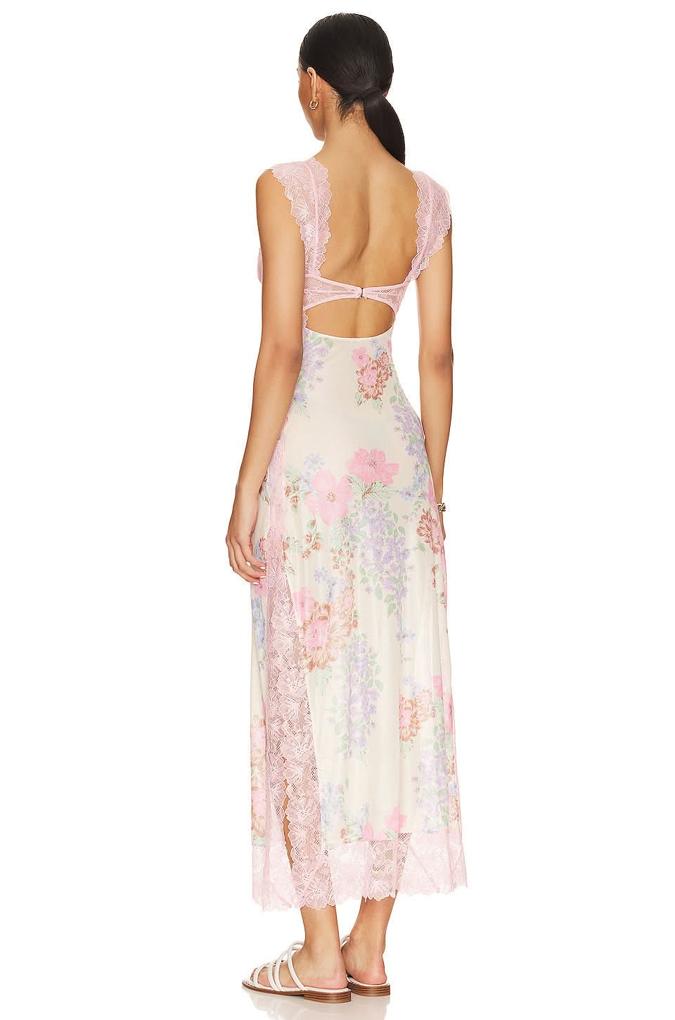 Back view of pink cutout midi dress showing open back design