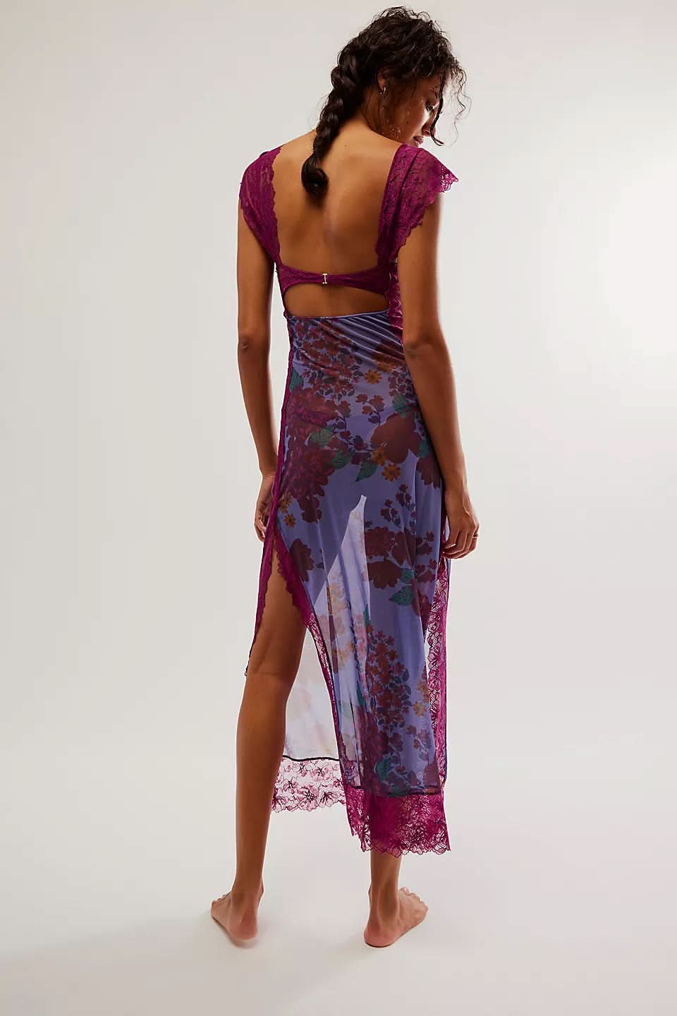Back view of magenta cutout midi dress with side slit detail
