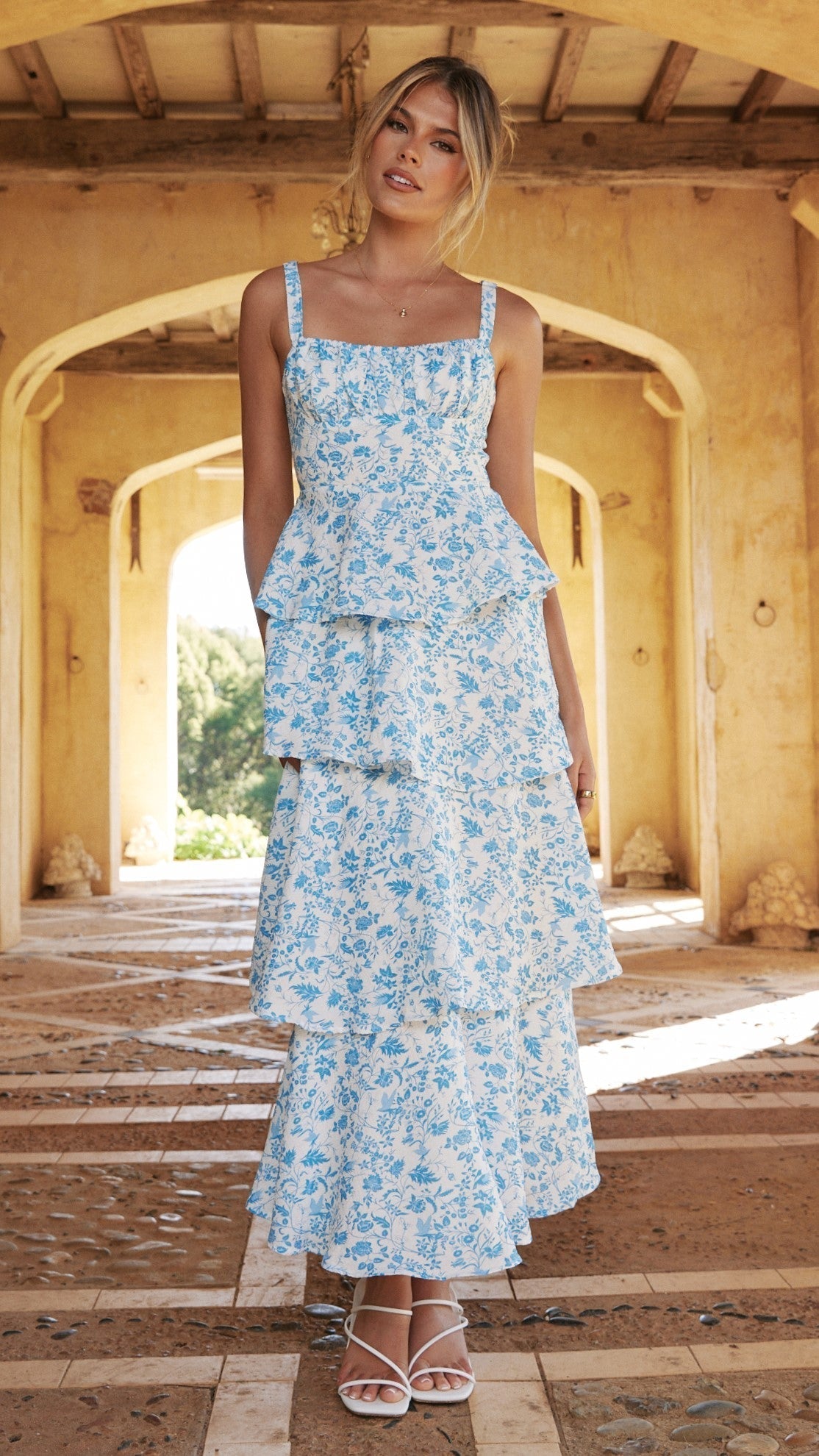 Blue and white floral maxi dress with stacked ruffle layers