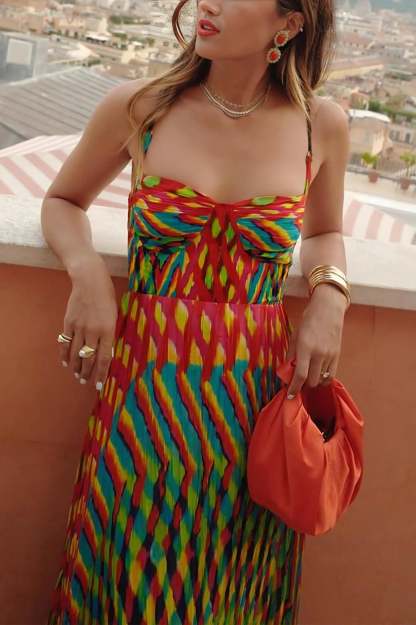 Sweetheart neckline pleated maxi dress in red with colorful geometric print and spaghetti straps