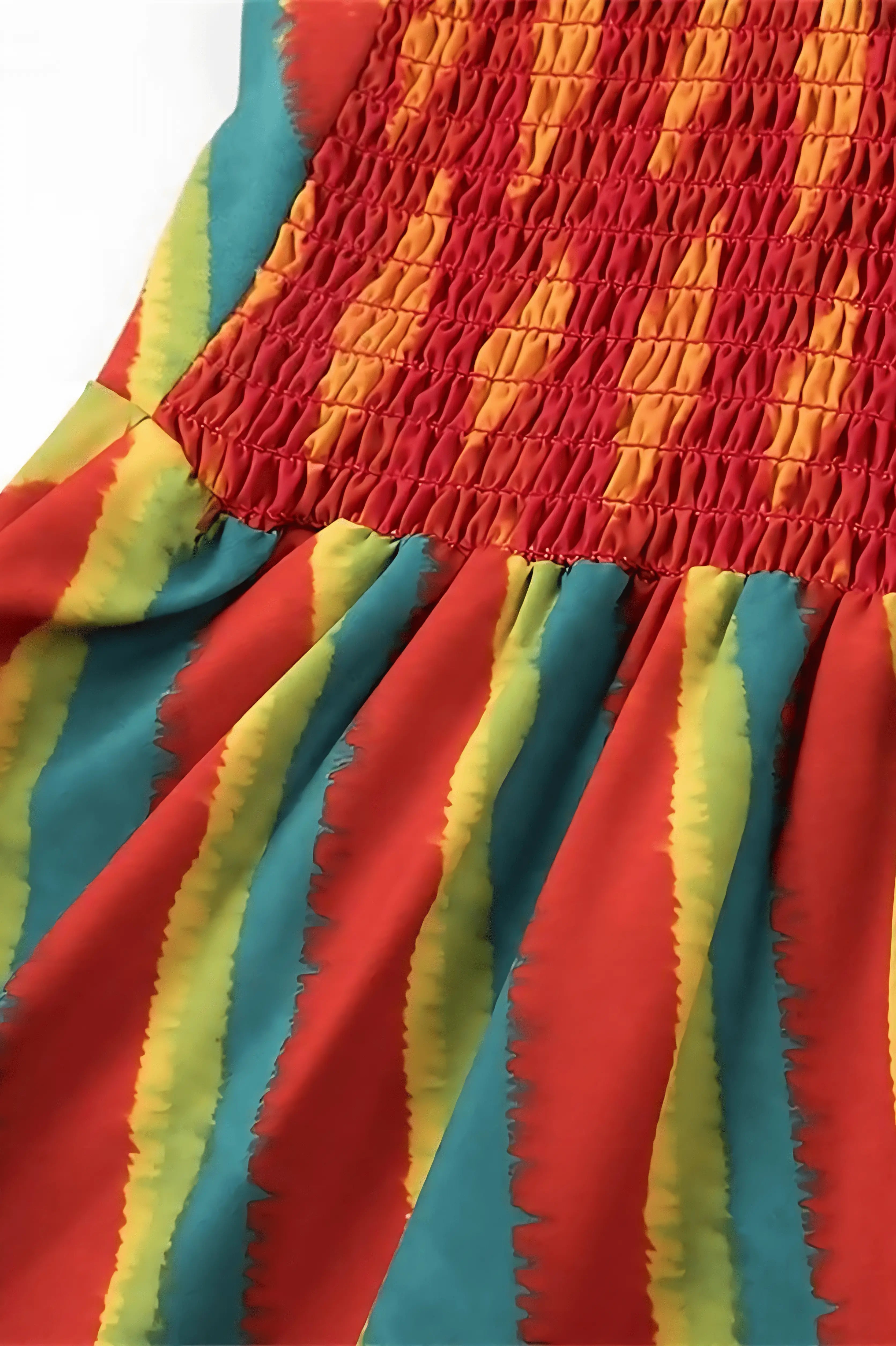 Close-up of pleated fabric showing red, yellow, blue and green geometric pattern detail