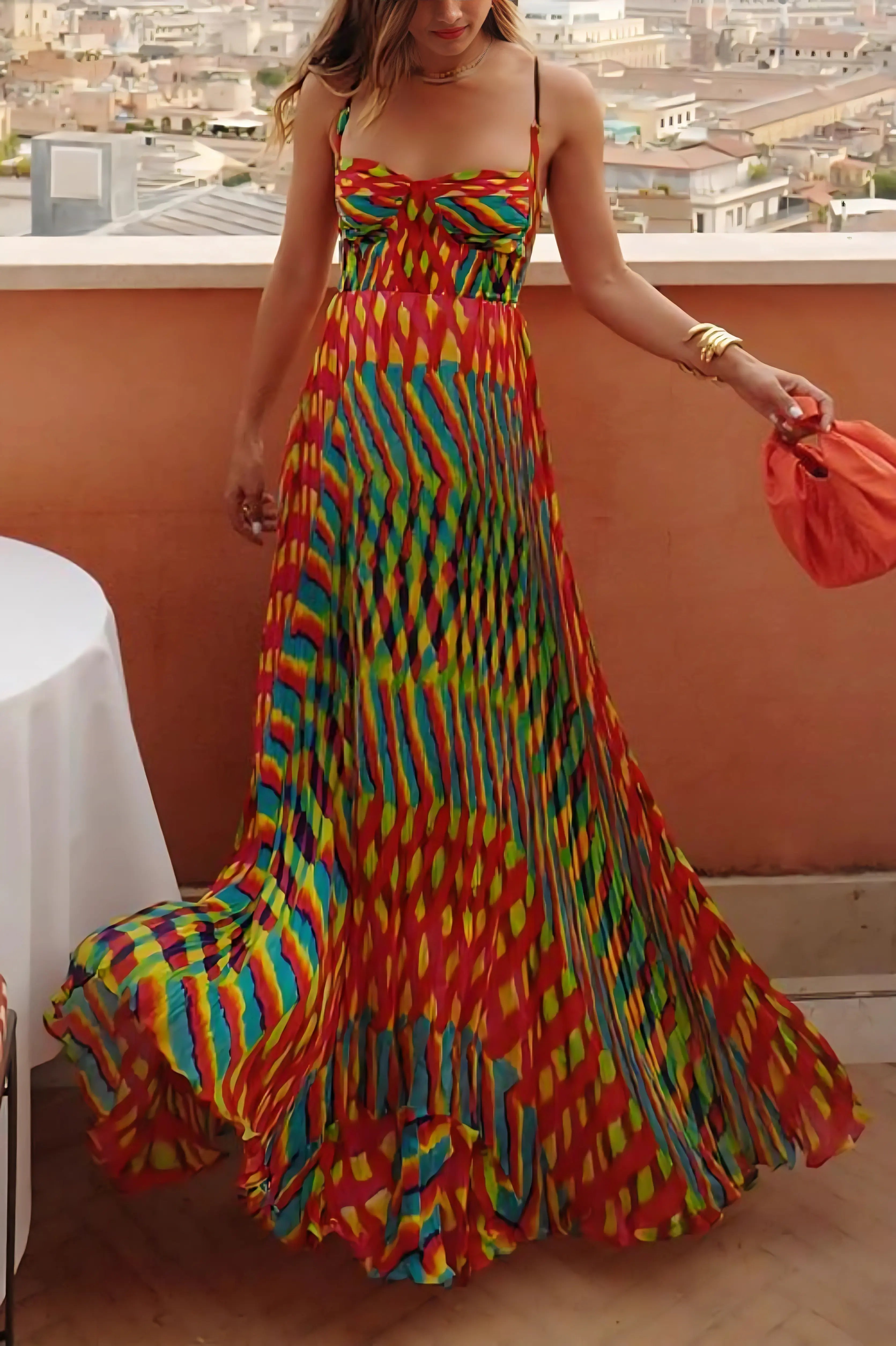 Multicolor pleated maxi dress with red, yellow, blue and green geometric pattern and train