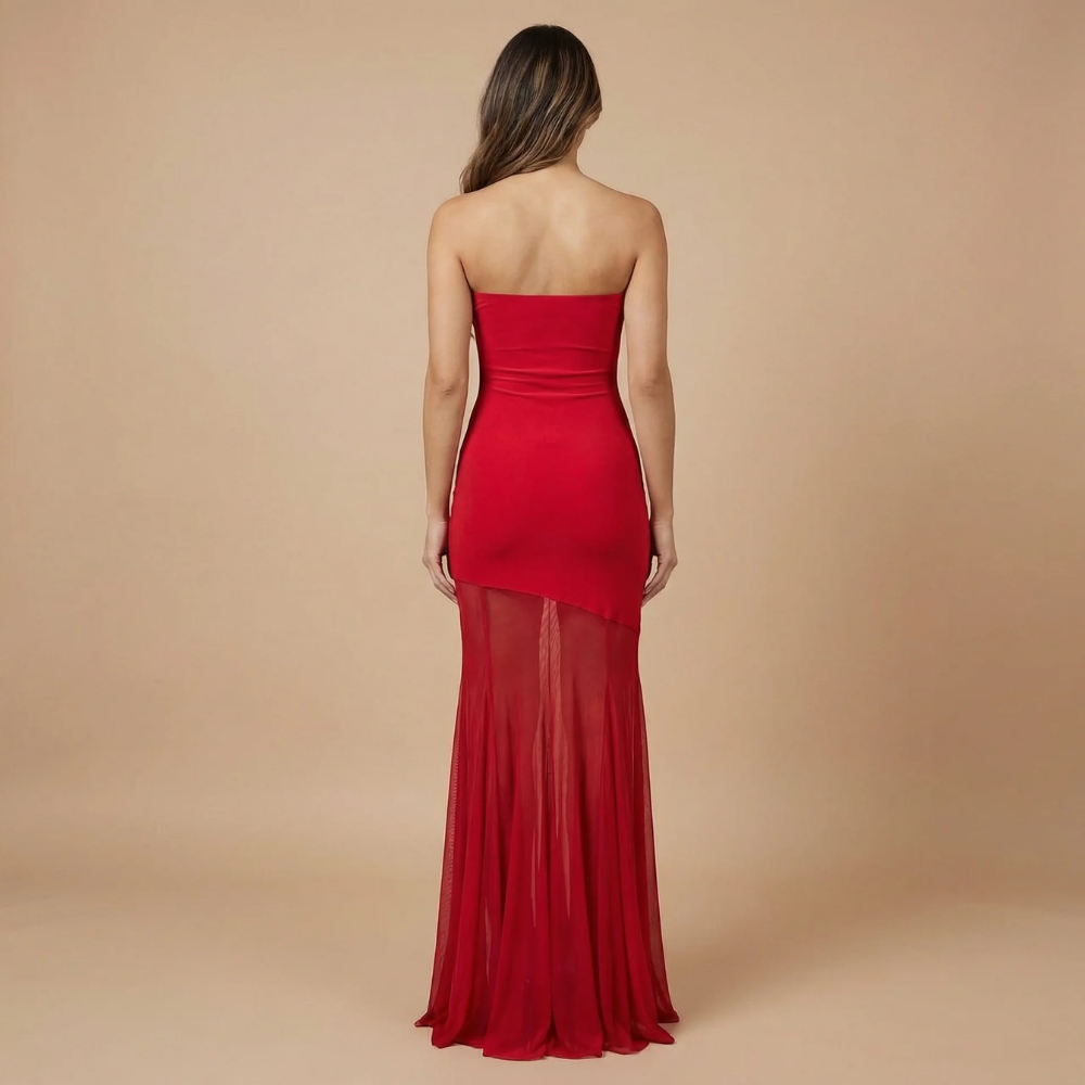 Back view of red strapless maxi dress with flowing mesh skirt