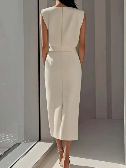 Cream button midi dress back view showing center seam and slit detail