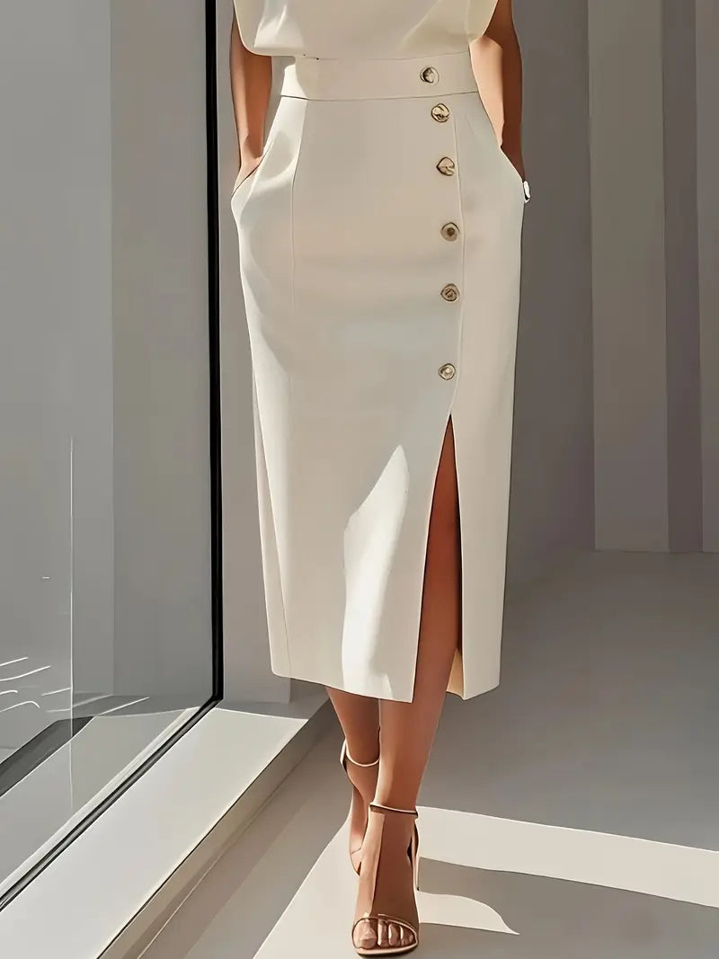 Cream midi dress detail showing metallic button closure and front slit