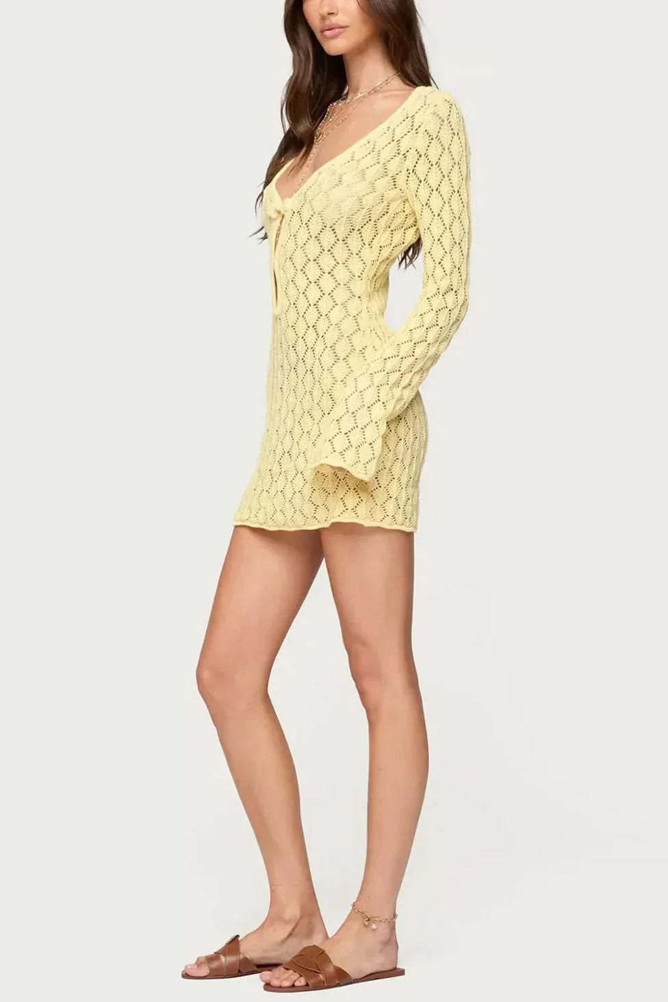 Yellow openwork mini dress with tie-front neckline and fitted long sleeves