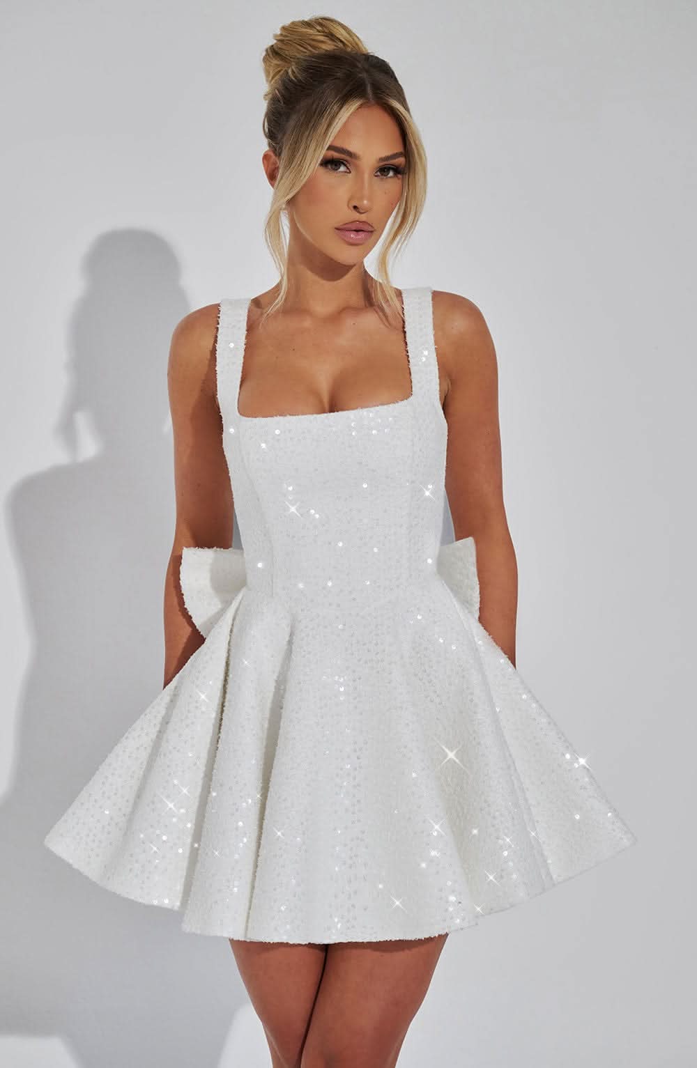 White sequin mini dress with square neckline and full skirt