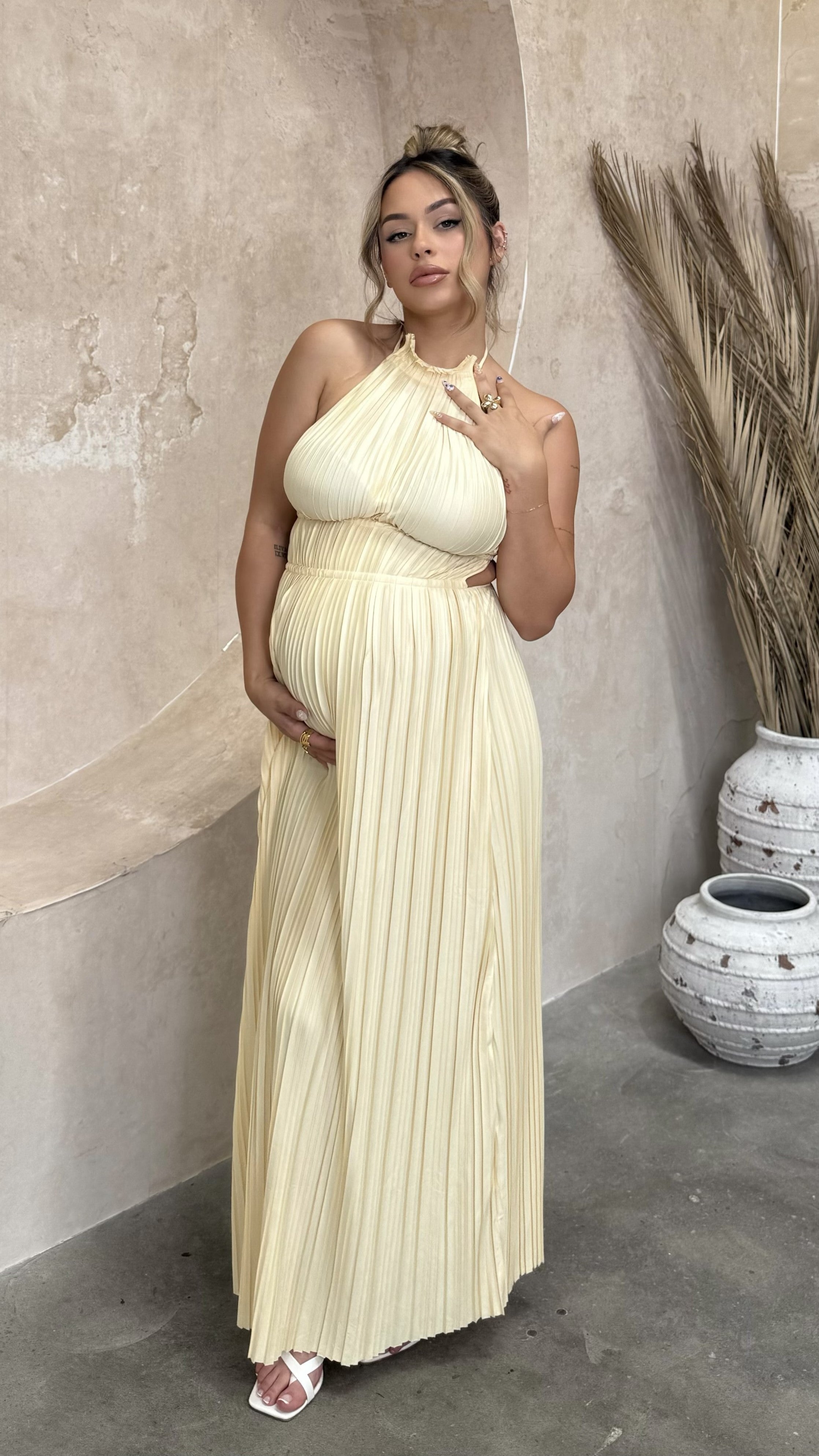 Cream pleated maxi dress with halter neckline and gathered bodice detail