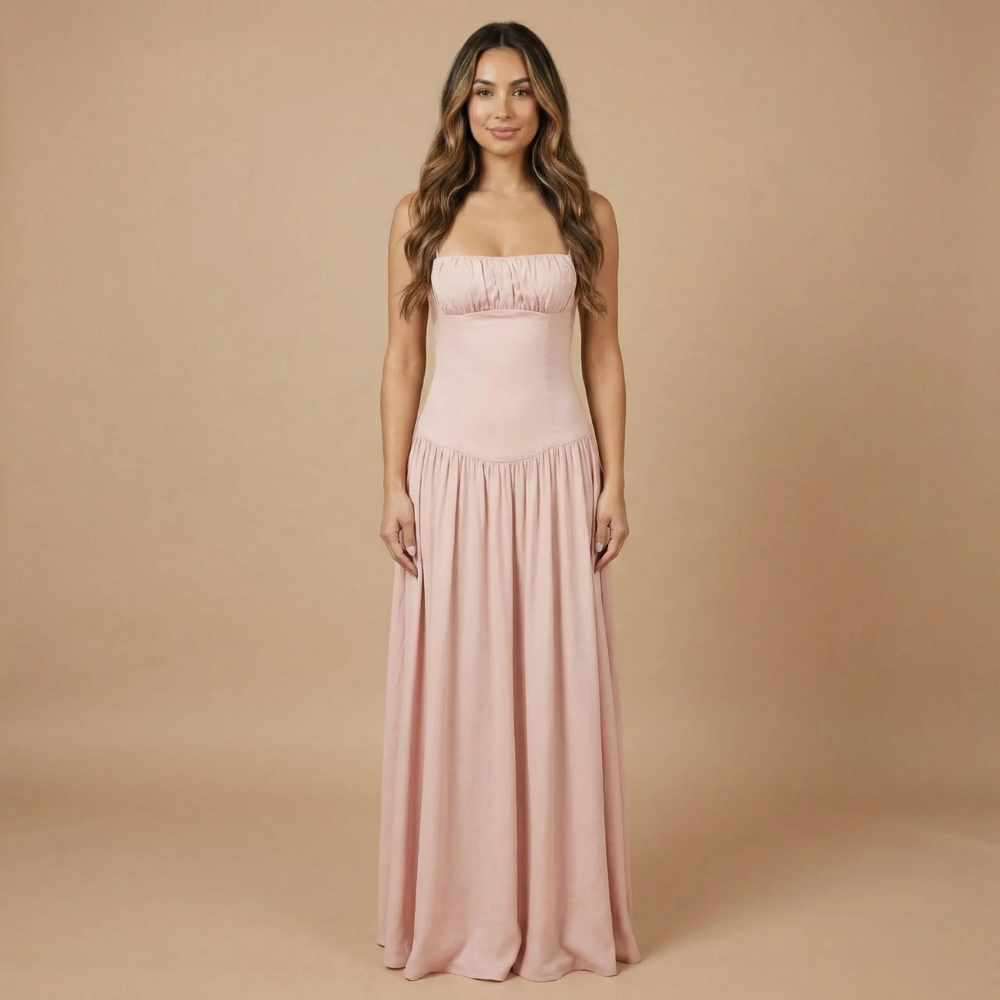 Blush pink ruched maxi dress with fitted bodice and spaghetti straps for women