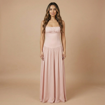 Blush pink ruched maxi dress with fitted bodice and spaghetti straps for women