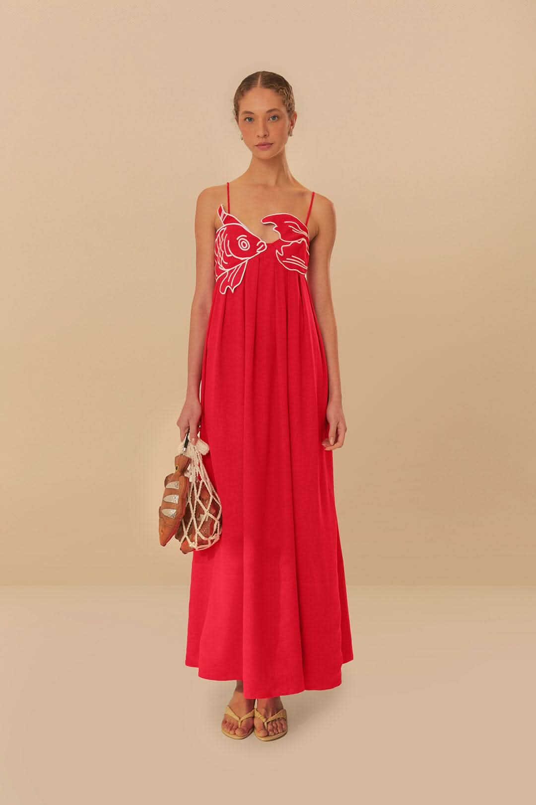 Red maxi dress with white embroidered fish design and spaghetti straps