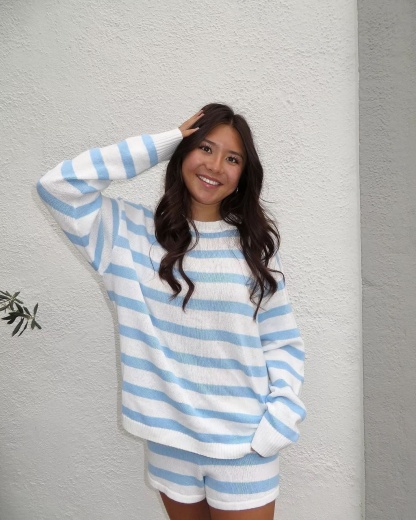 Blue and white striped knit sweater with relaxed fit shorts
