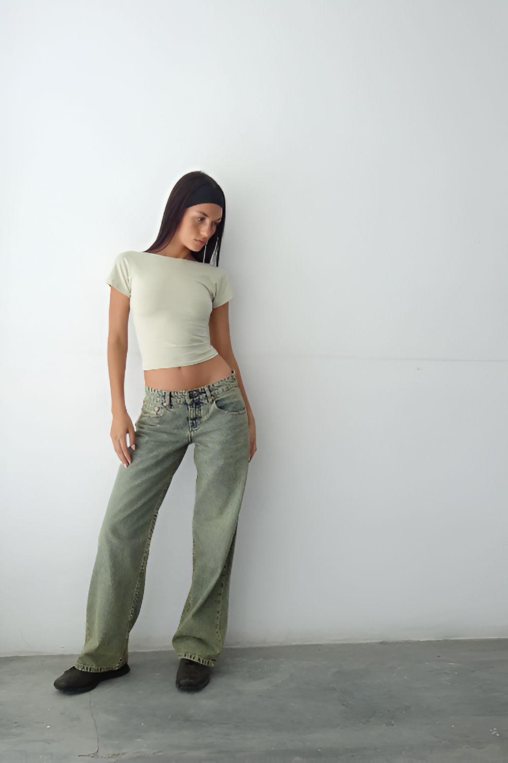 Sage green wide leg jeans with relaxed fit and vintage-inspired wash