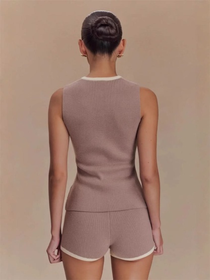 Back view of taupe sleeveless knit top with cream neckline trim