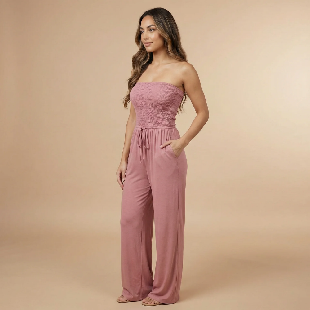 Mauve pink strapless smocked jumpsuit with drawstring waist and wide-leg pants