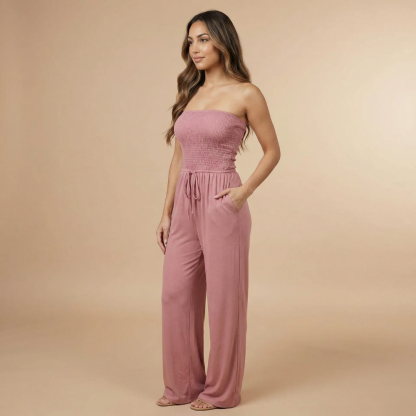 Mauve pink strapless smocked jumpsuit with drawstring waist and wide-leg pants