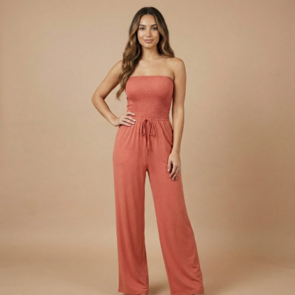 Coral smocked strapless jumpsuit with drawstring waist and wide-leg pants