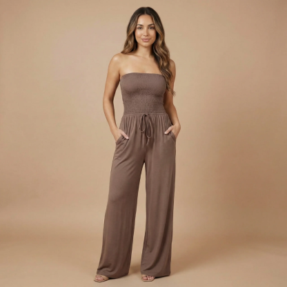 Taupe brown strapless smocked jumpsuit with side pockets and flowing wide legs
