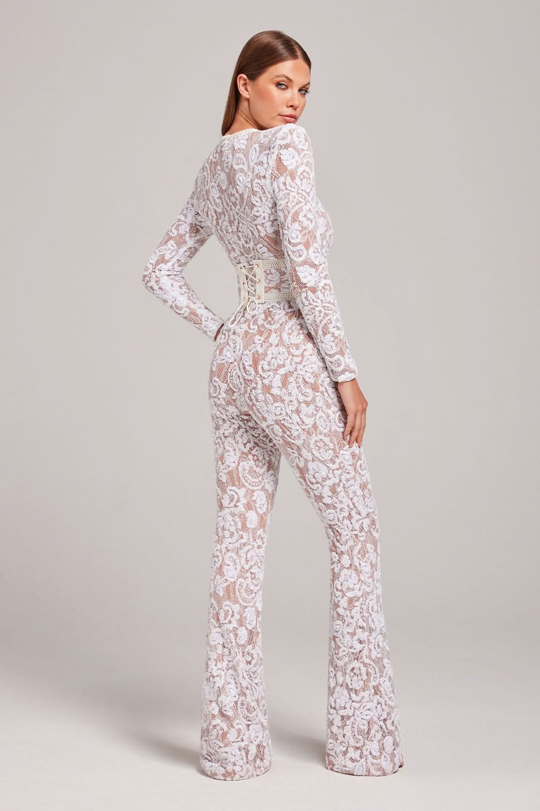 Blush lace jumpsuit back view with long sleeves and flared legs