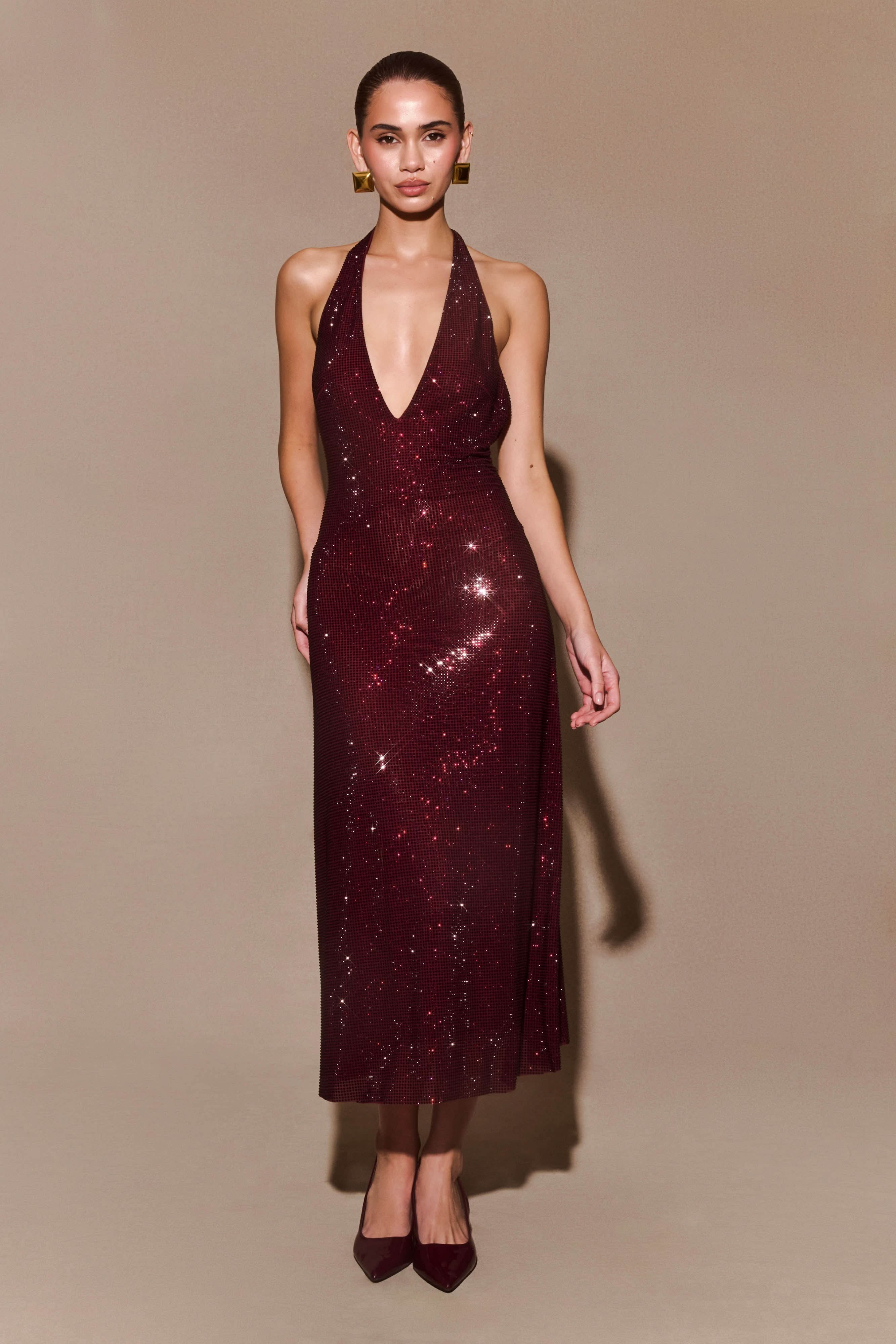 Burgundy sequin halter midi dress with deep V-neckline and open back