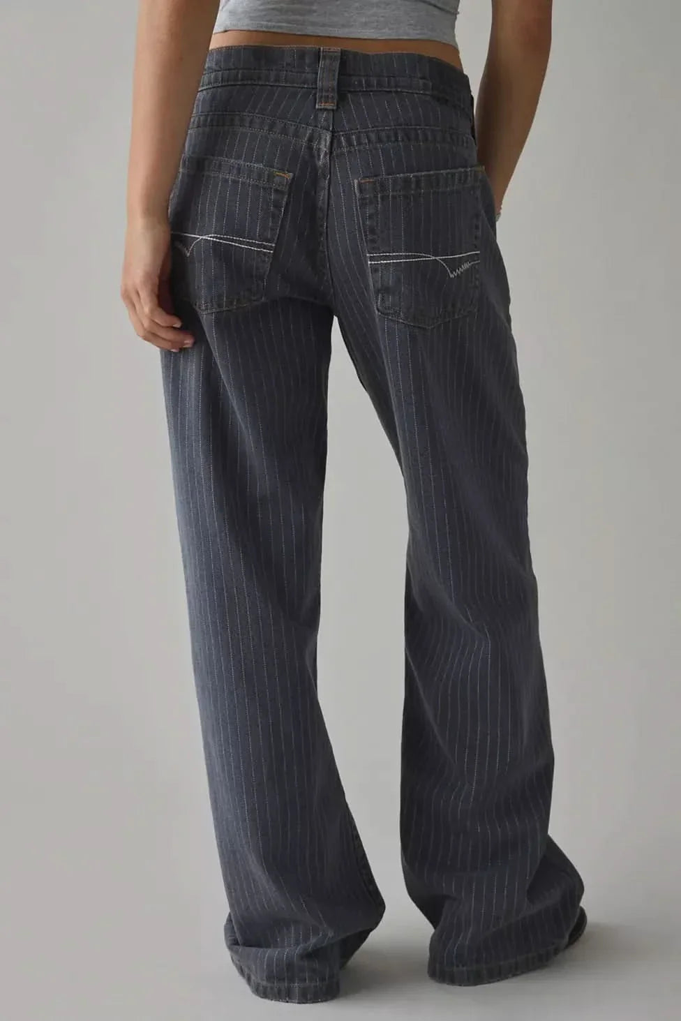 Back view of dark indigo wide-leg jeans showing full-length hem and pinstripe pattern