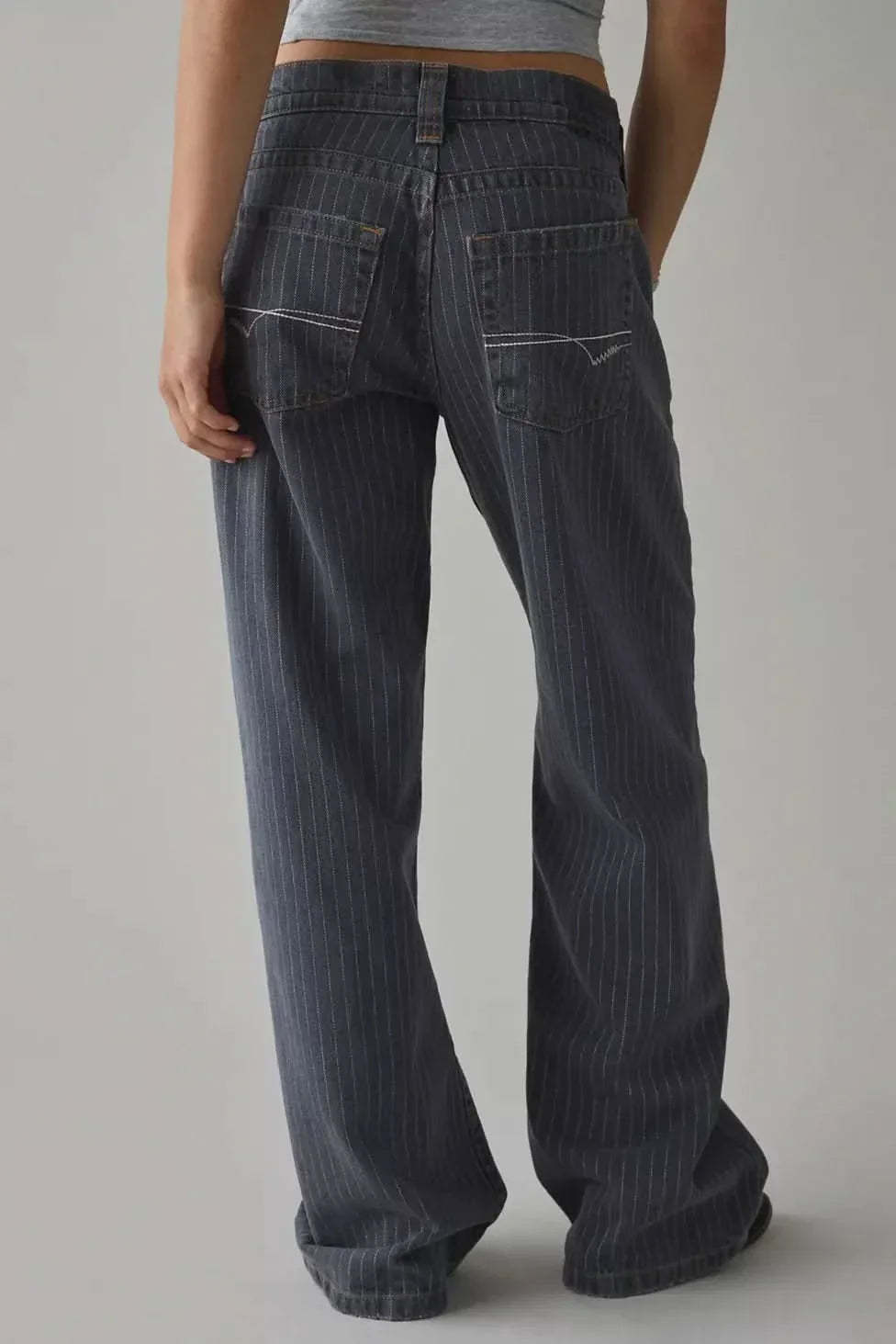 Back view of dark indigo wide-leg jeans showing full-length hem and pinstripe pattern
