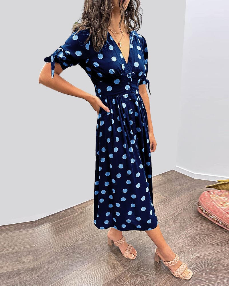 Navy blue wrap midi dress with light blue polka dot print
