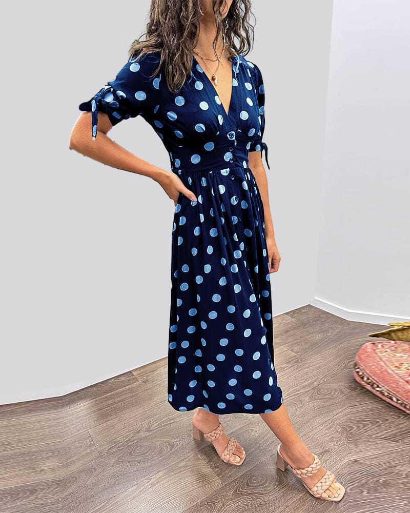 Navy blue wrap midi dress with light blue polka dot print