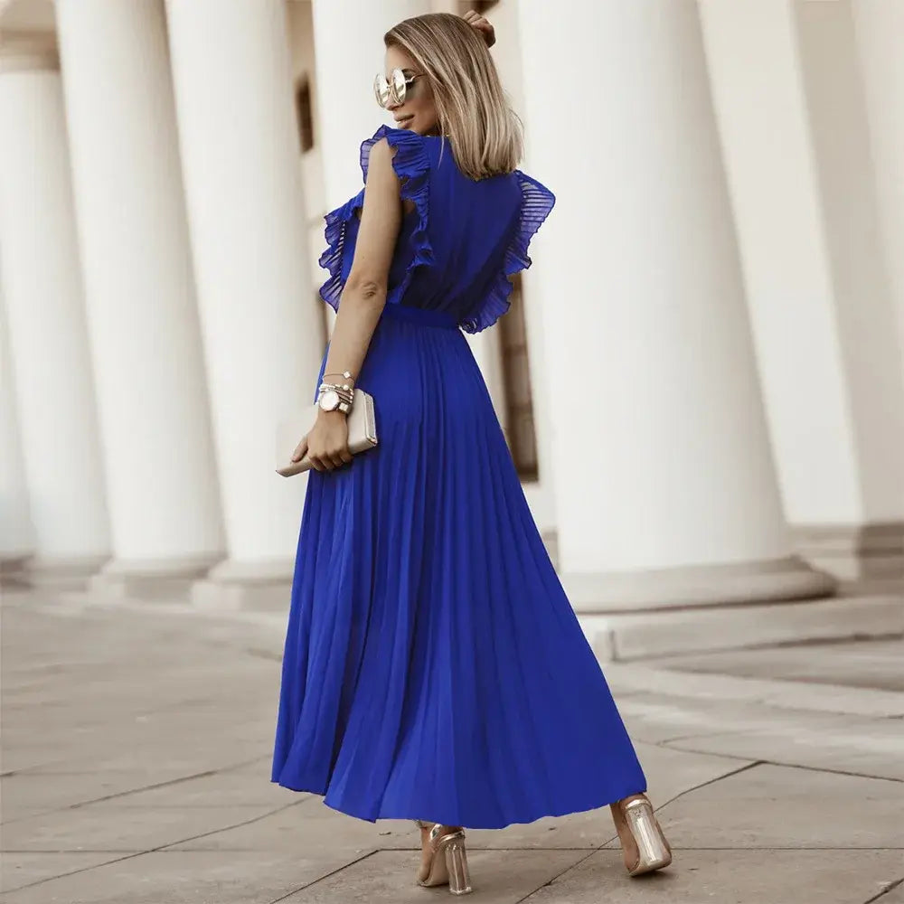 Back view of royal blue ruffle maxi dress with flowing pleats