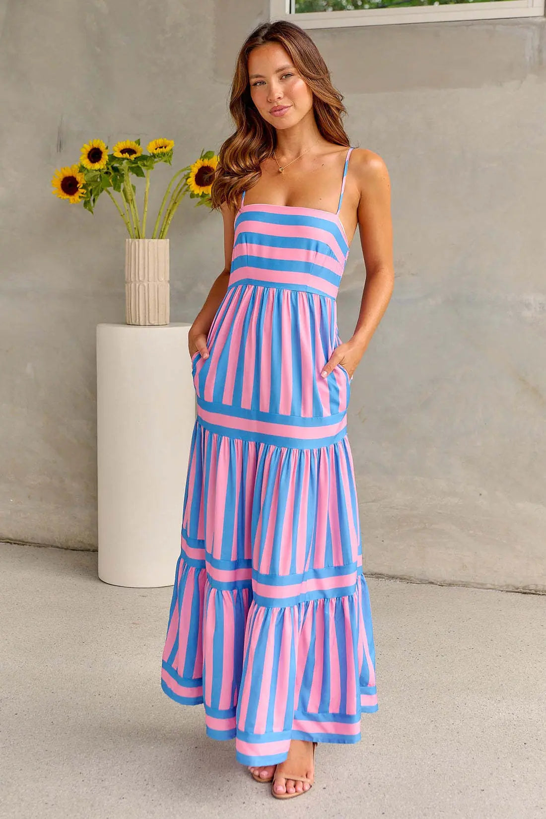 Pink and blue striped spaghetti strap maxi dress with side pockets and tiered layers
