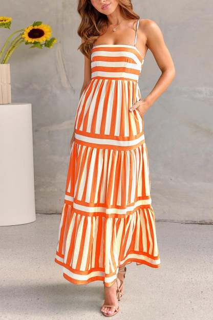 Orange and white striped women's maxi dress with fitted bodice and flowy pleated skirt