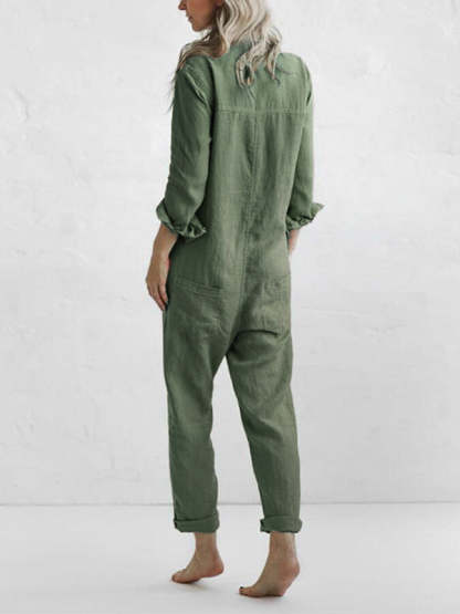 Back view of sage green linen jumpsuit with rolled cuffs