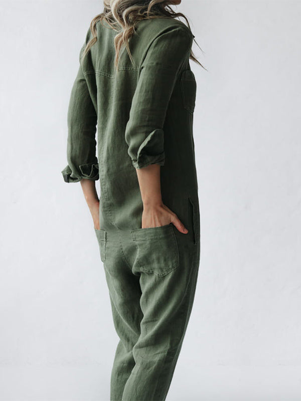 Side detail of sage green jumpsuit showing chest pocket and button closure