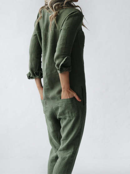 Side detail of sage green jumpsuit showing chest pocket and button closure