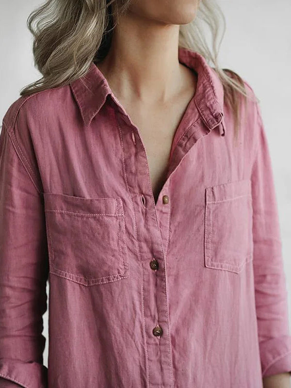 Close-up of mauve pink jumpsuit collar, chest pockets, and button front