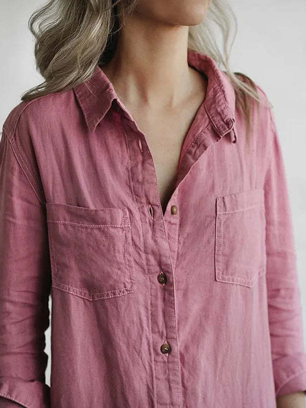Close-up of mauve pink jumpsuit collar, chest pockets, and button front