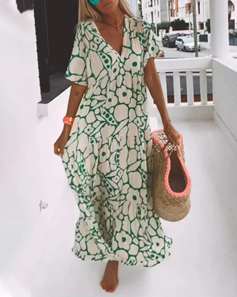 Front view of green floral maxi dress with V-neck and short sleeves
