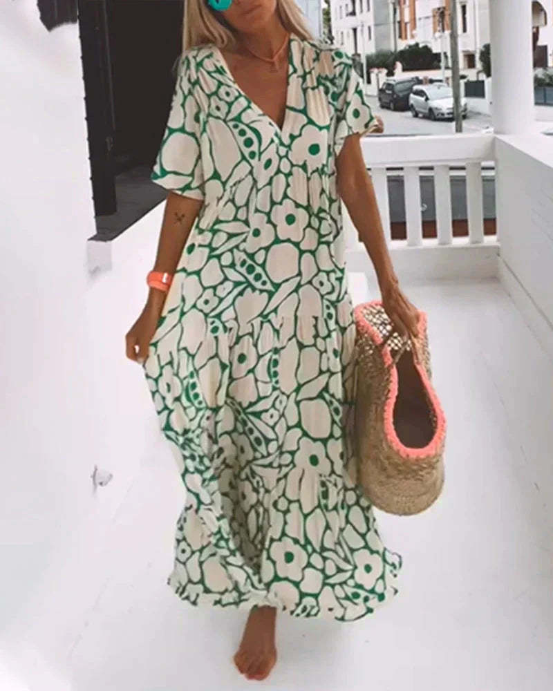 Front view of green floral maxi dress with V-neck and short sleeves