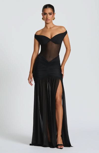 Black off-shoulder ruched maxi dress with high leg slit and sheer bodice